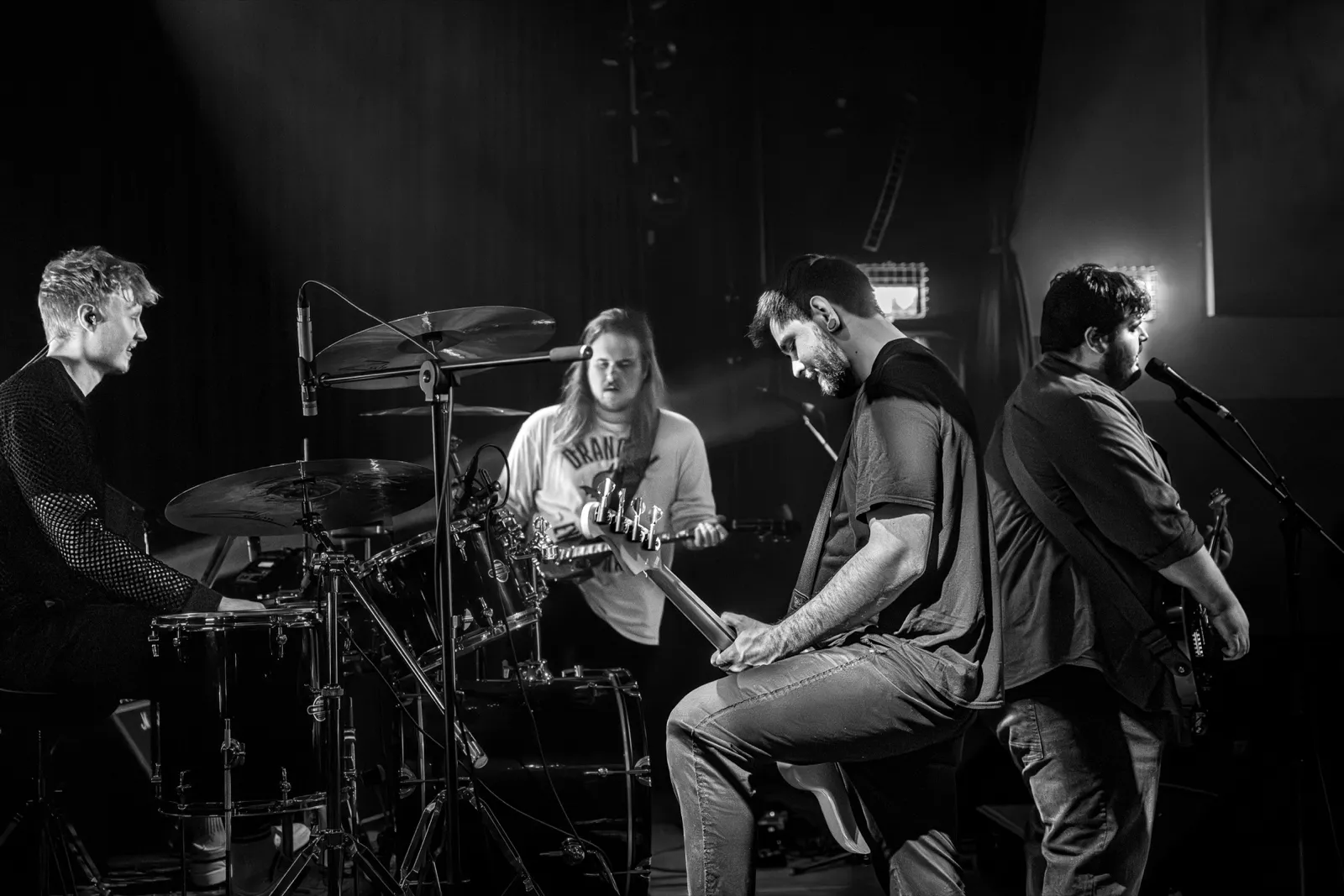 Black and white: the whole band on the Quax stage, drummer on the left