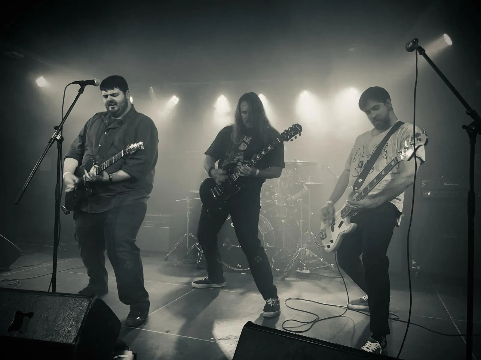 The band on the Strom stage in haze and white light